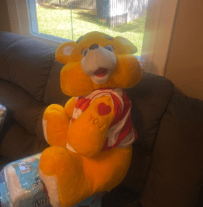 A large stuffed teddy bear that was originally at the bottom of the closet. 