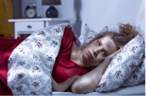 Woman lying in bed not sleeping